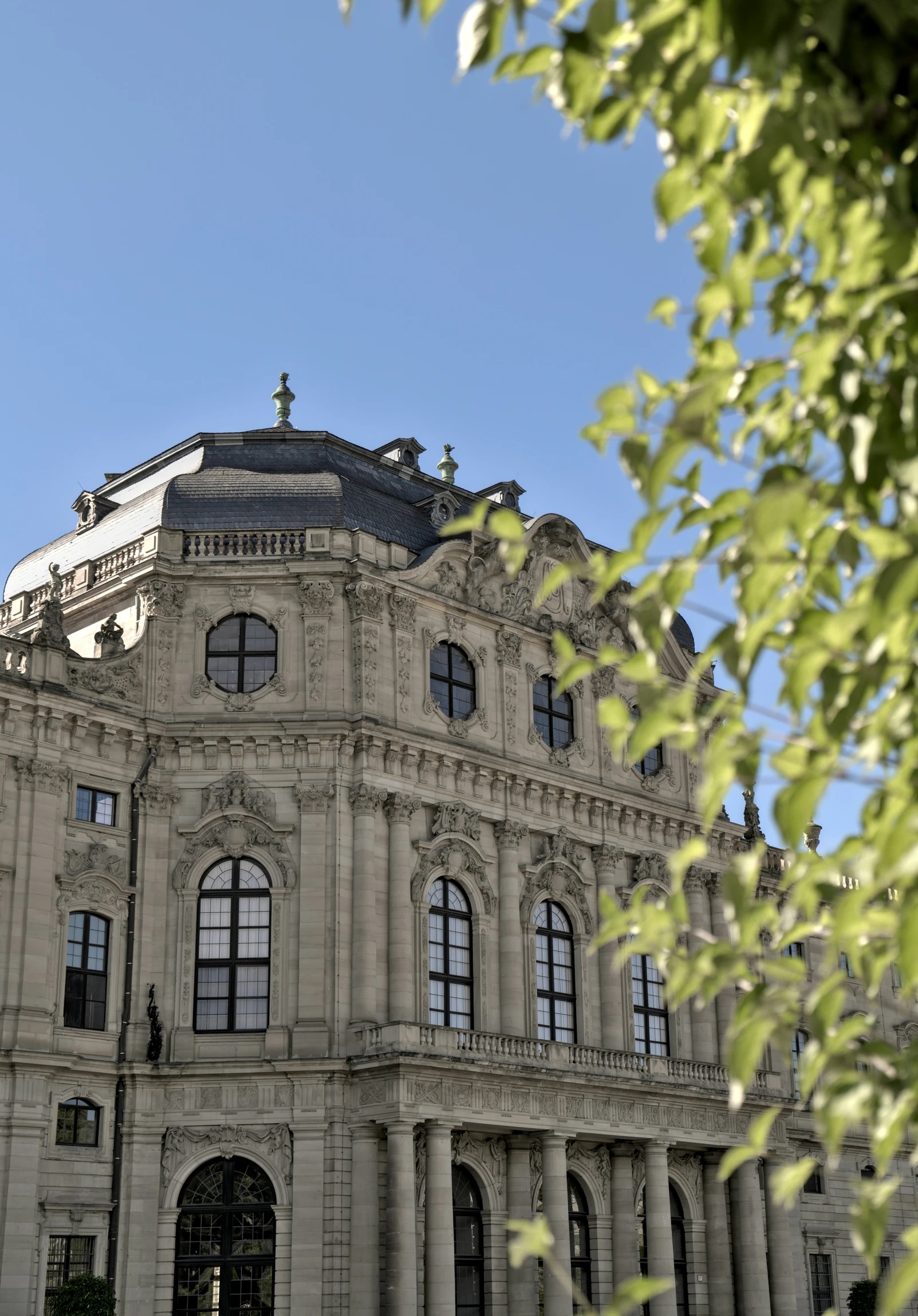 a white building with lots of windows under a blue sky