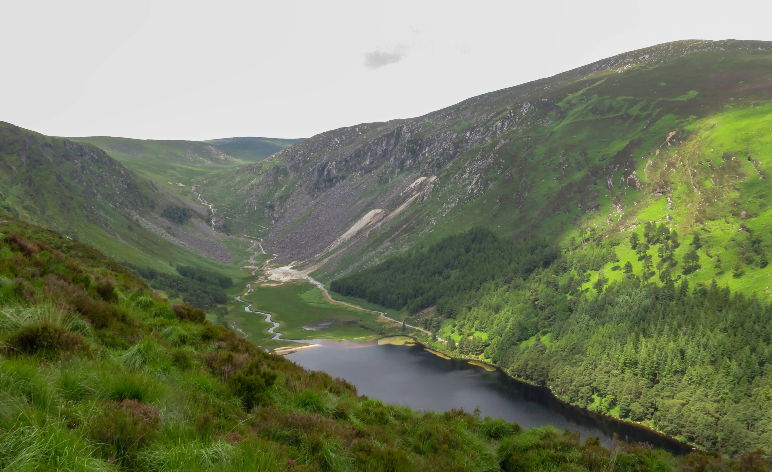 looking down onto the valley with a lake in the middle