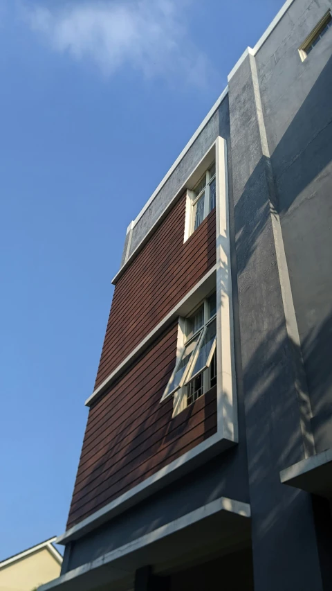 the house has an open window and a view of the sky