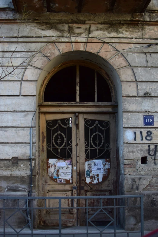 a door has graffiti on it outside a building