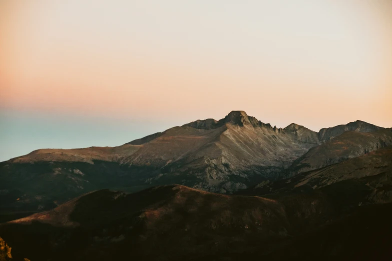 the mountain has mountains that are all brown and gray