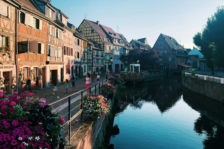 a river runs down the side of several old buildings