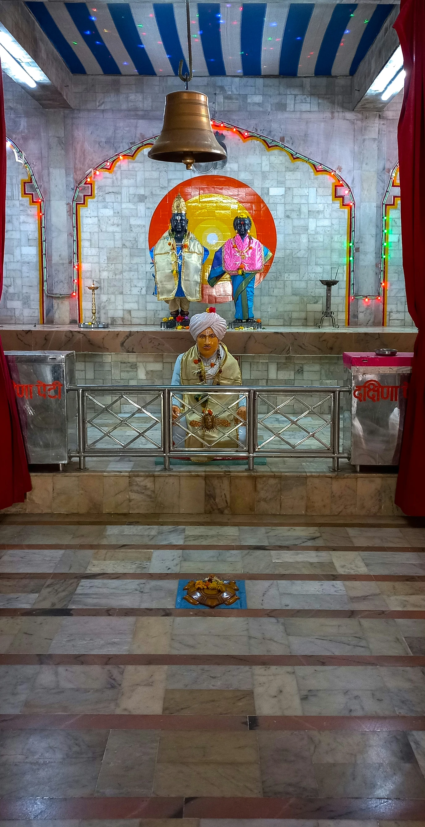 an image of a shrine with a bell