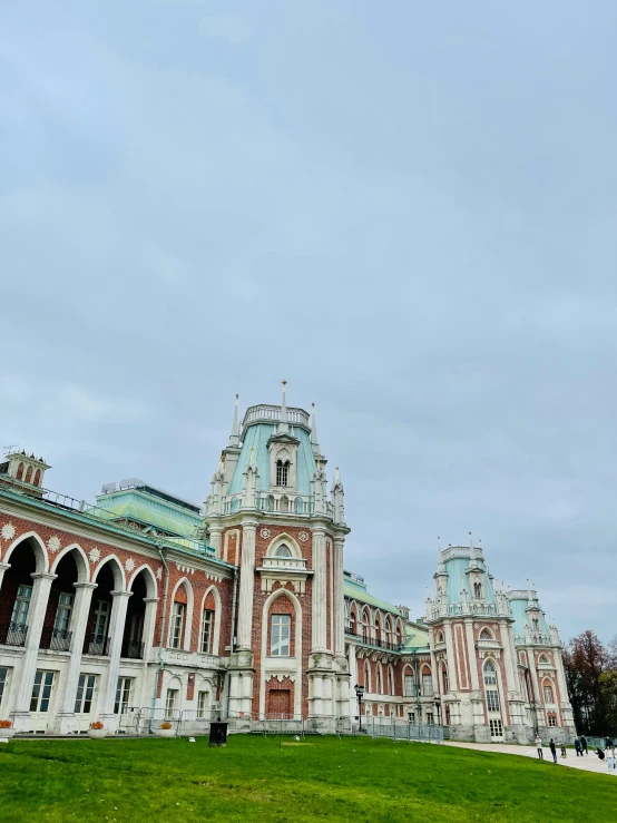 a large building with two flags on each side