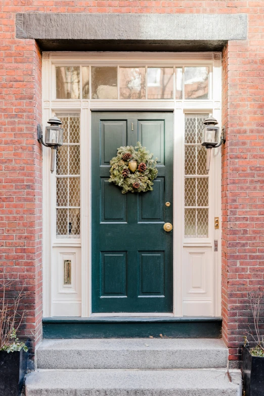 the front door of a house with a wreath on it