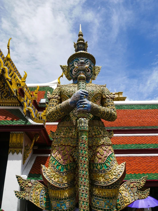 a close - up of a sculpture of a man with a crown on top