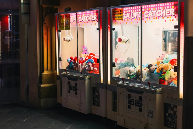 two old fashioned machines with some candy on top