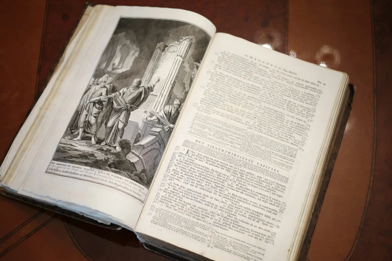 a book open on top of a wooden table