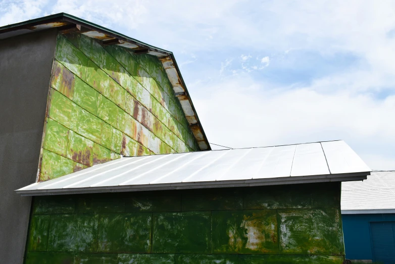 a picture of the back of a building with graffiti on it