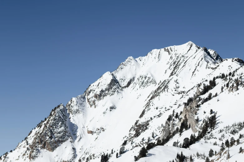 a mountain is covered with lots of snow