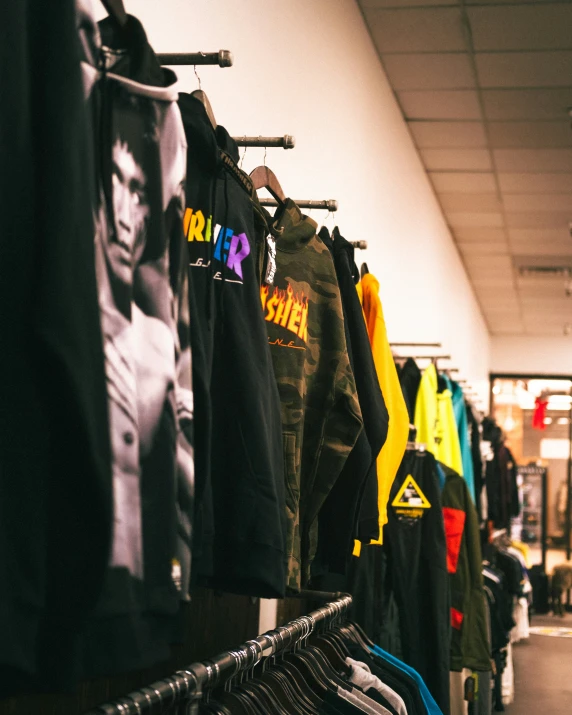 a store selling a bunch of shirts hanging on a rack