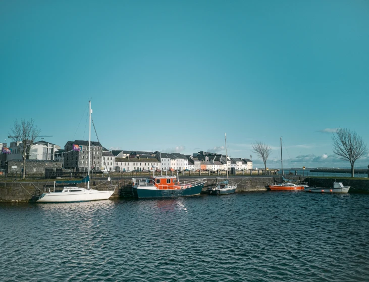 a group of boats that are sitting in the water