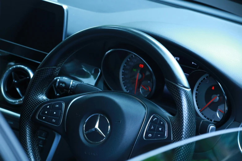 a steering wheel in a vehicle with a dash light on