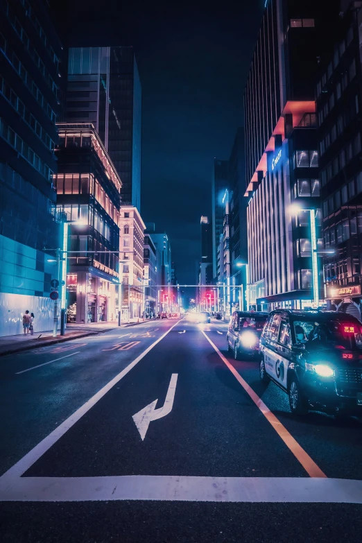 the view of an empty city street at night