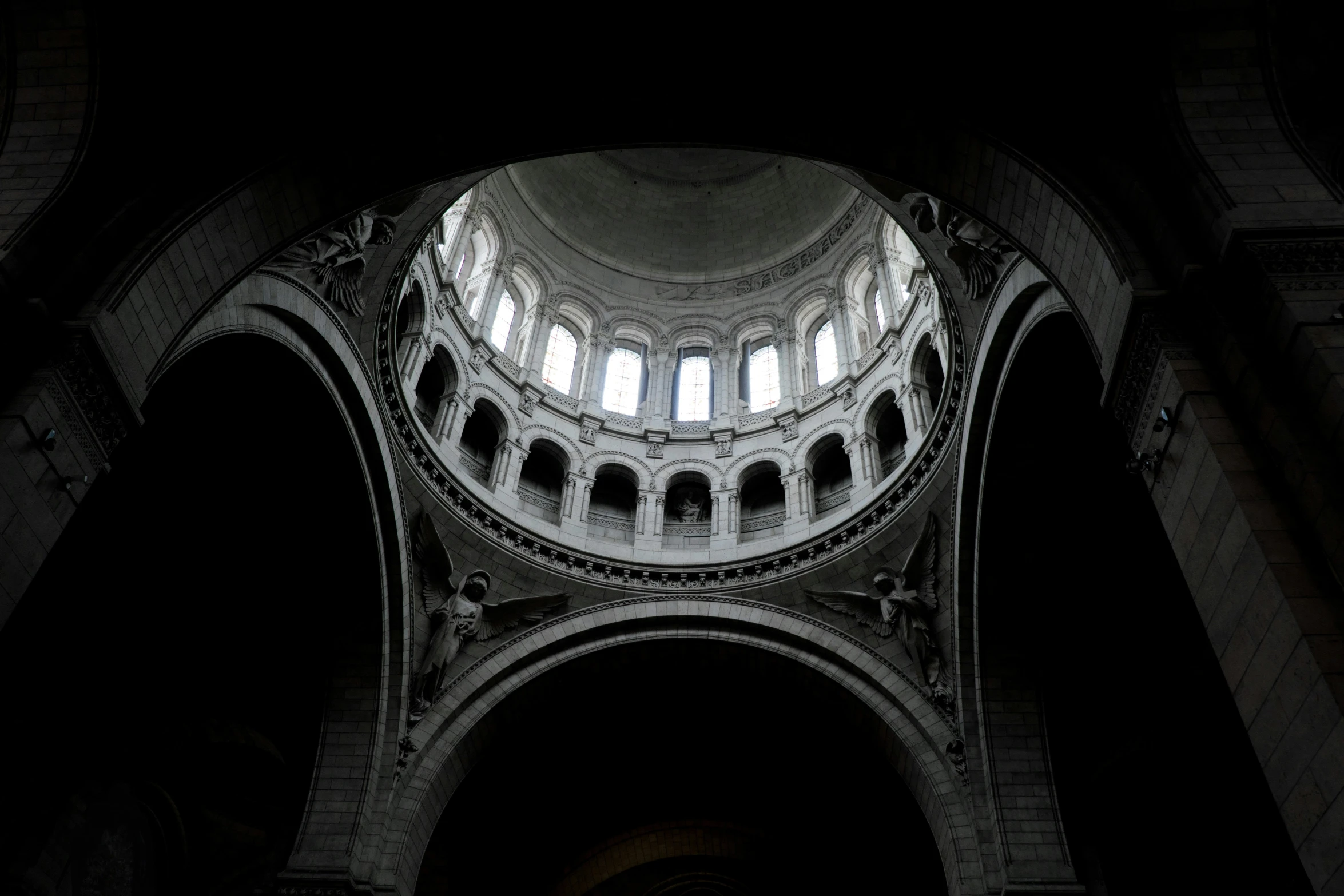 a room filled with lots of tall arches