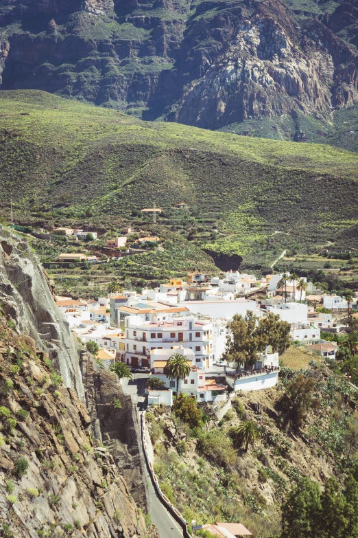 a city on the cliff side of a mountain