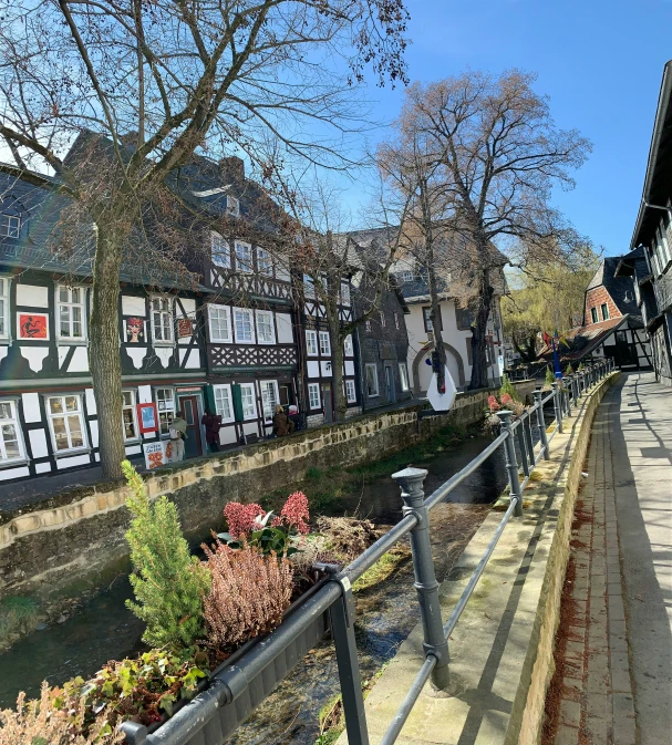 a long row of homes next to a river