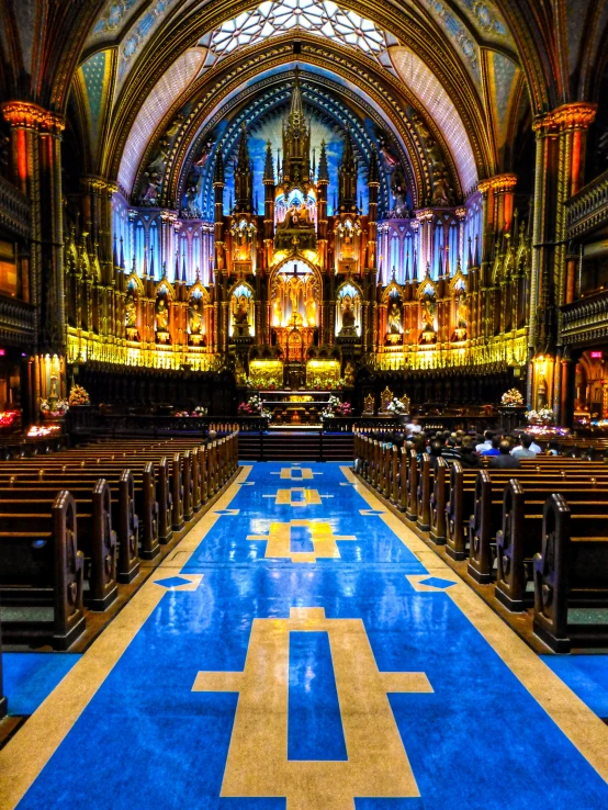 an empty cathedral with a large blue and yellow floor