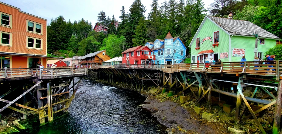 a street and bridge with multiple buildings at one end