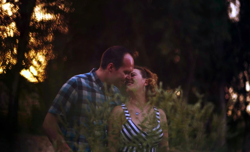 a man and woman are standing close together