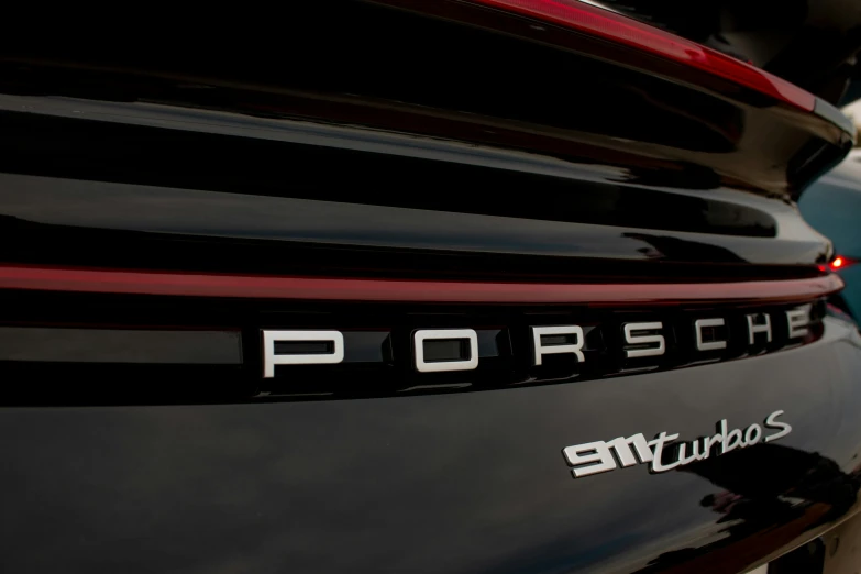 porsche emblem on the back of a vehicle