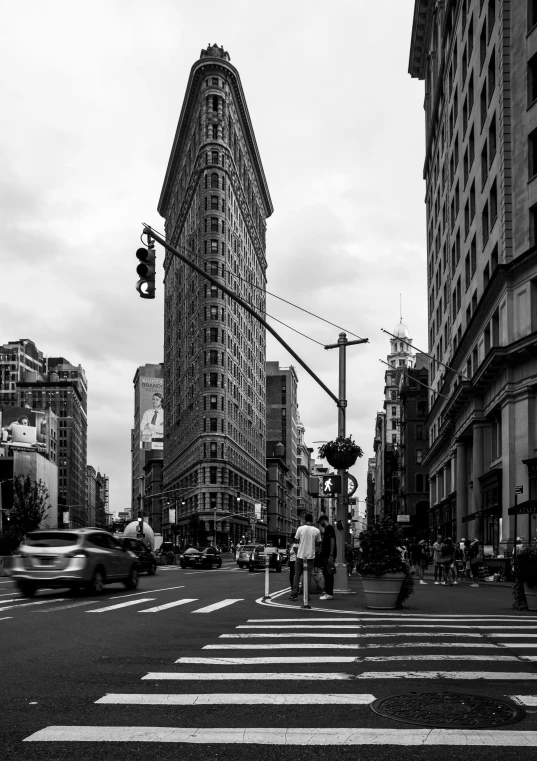 an urban city intersection with traffic lights and tall buildings