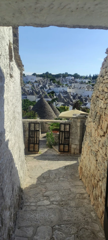 the stone houses have shutters on each window