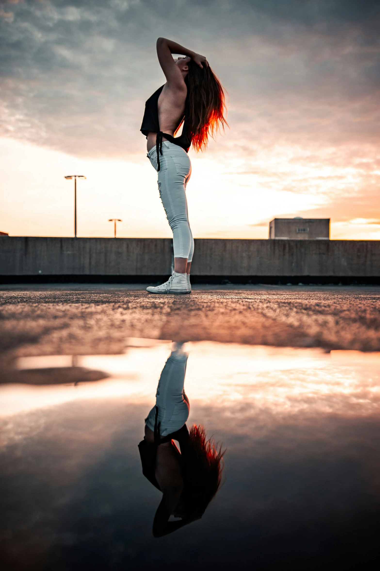 a woman leaning over in a black and white po