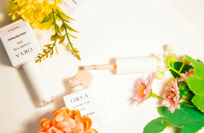 some flower and a white tube on a table