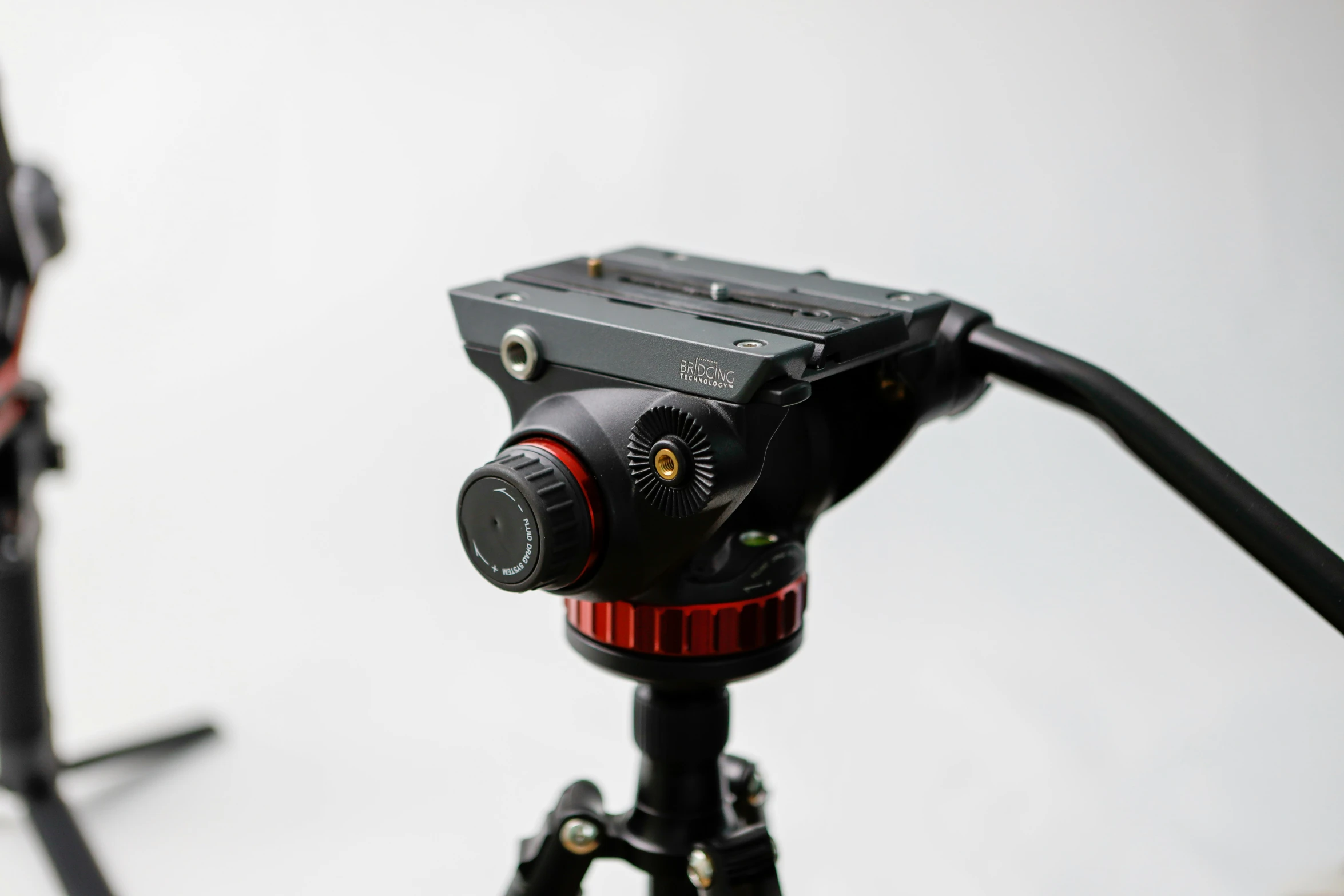 an external camera on tripod with the flash drive on facing up