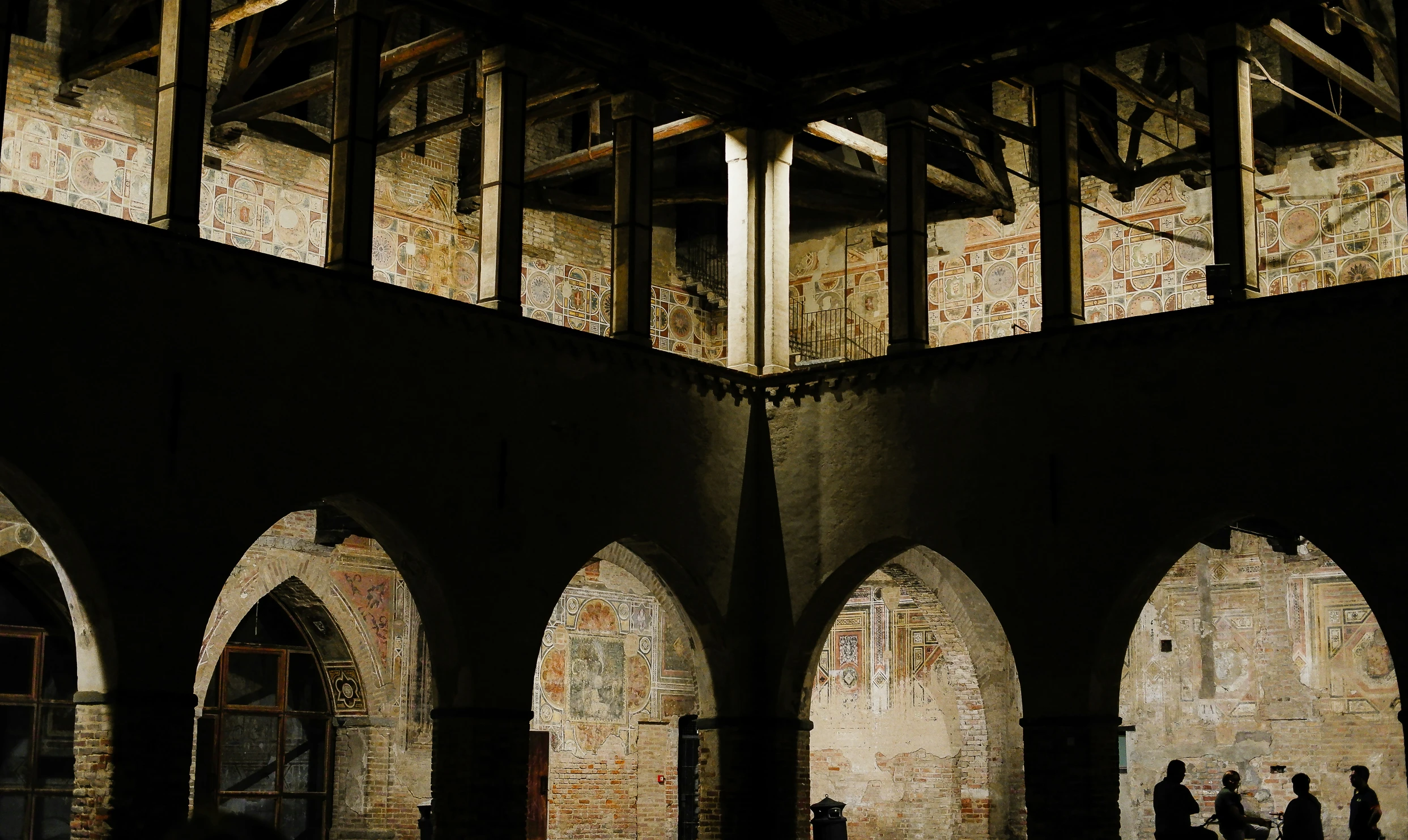 many arched windows are shown in this old building