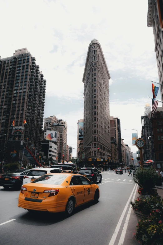 a taxi cab is driving down the street