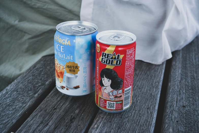 a can and can of food are laying on the wooden surface