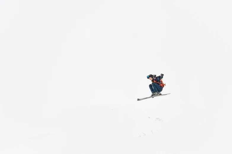 a man with a hat skiing on a slope