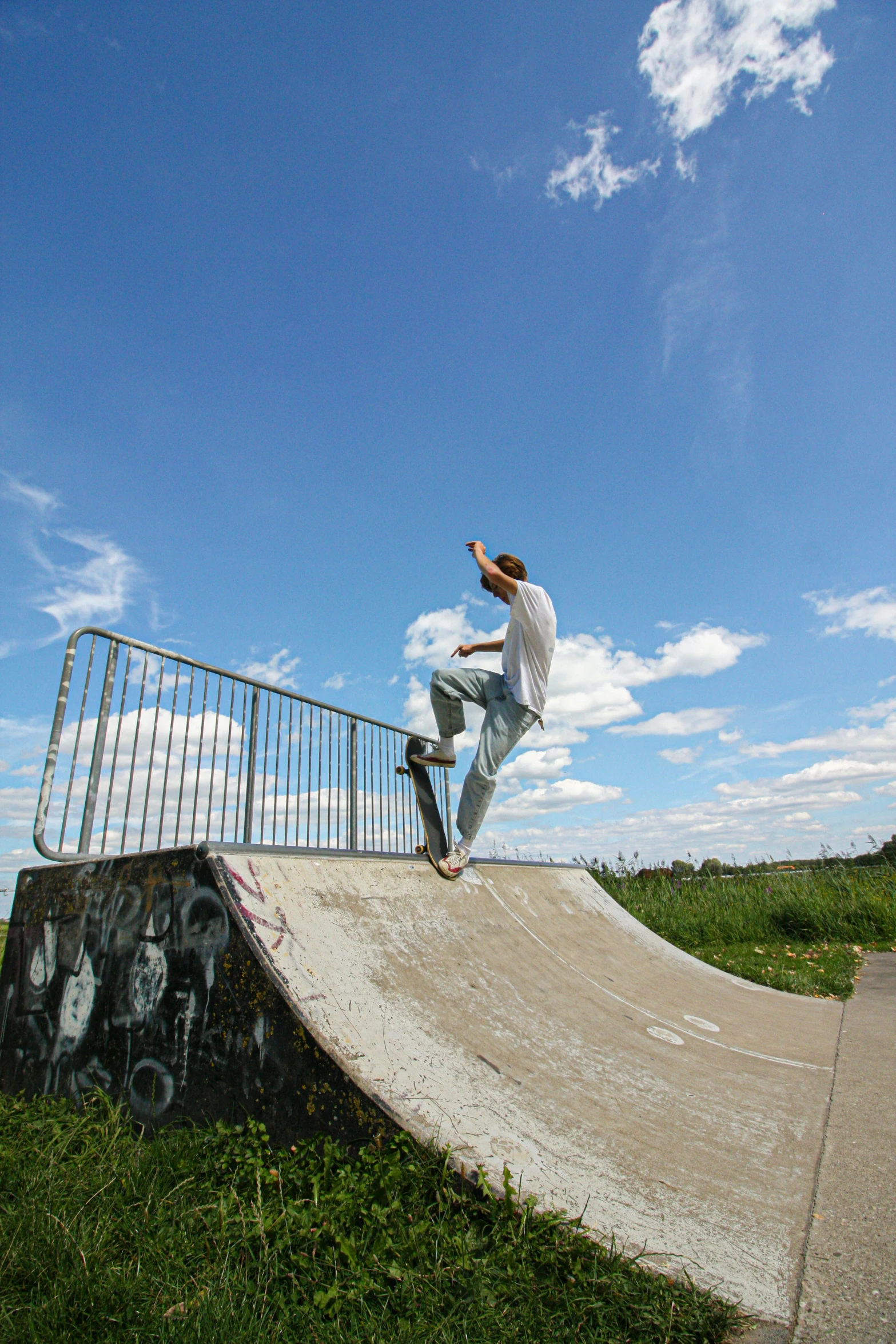 a man on a skateboard is riding up a ramp