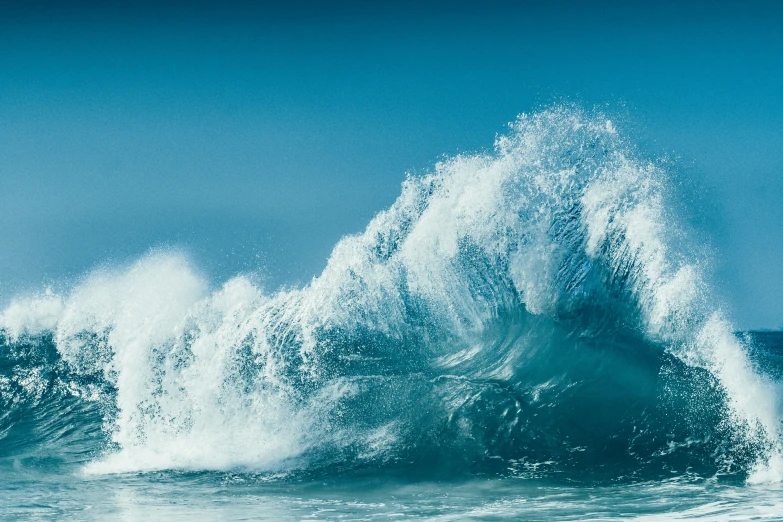 an ocean wave has splashing onto it