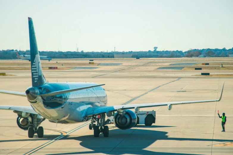 an airplane at the airport ready to take off