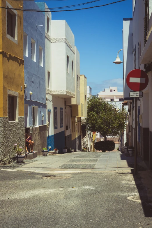 an old road with buildings along side it