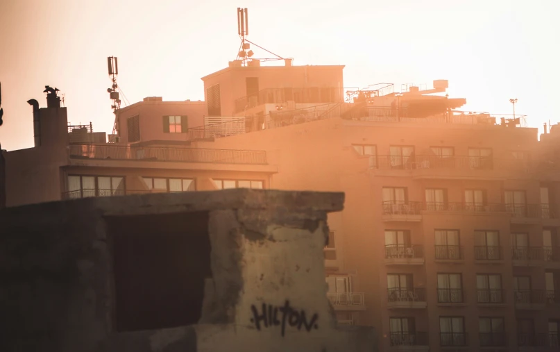 a very tall building with graffiti and a clock