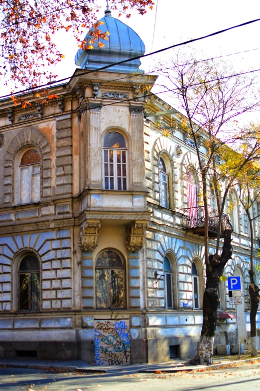 a city street corner with an old style building