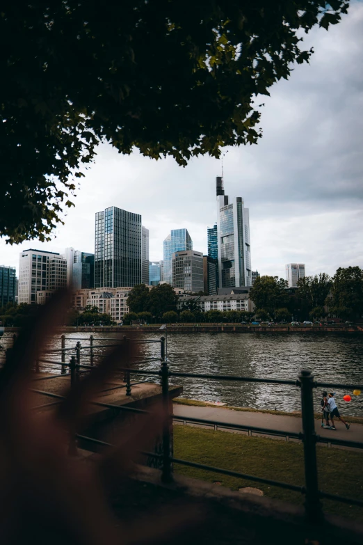 this po has a person holding their hand out near the river