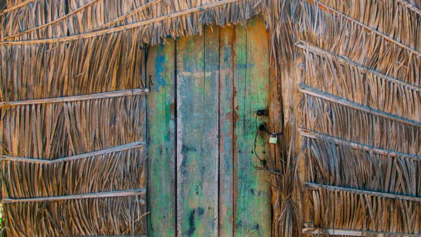 a doorway has a wooden handle and an overhang over it