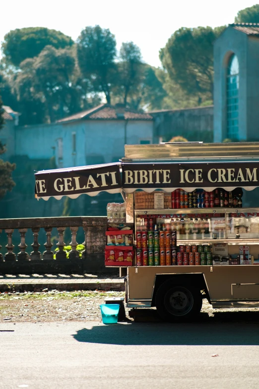 an ice cream cart sitting by the road