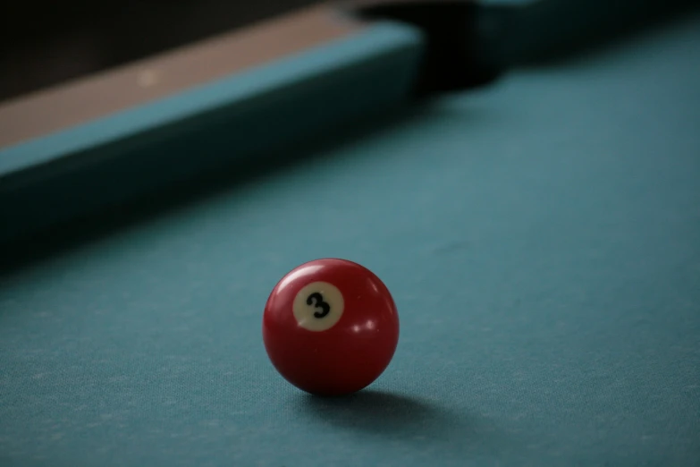 a pool ball with a black eight ball mark on it