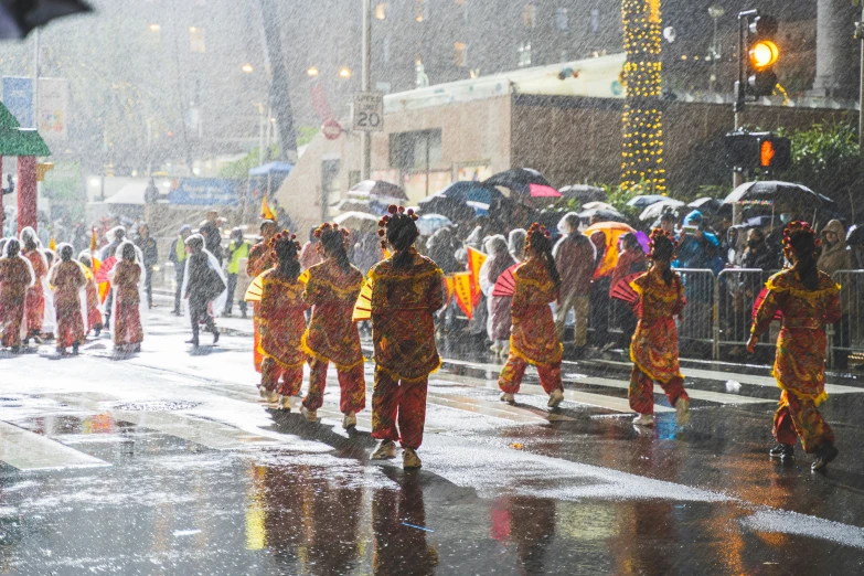 some people and umbrellas in the rain