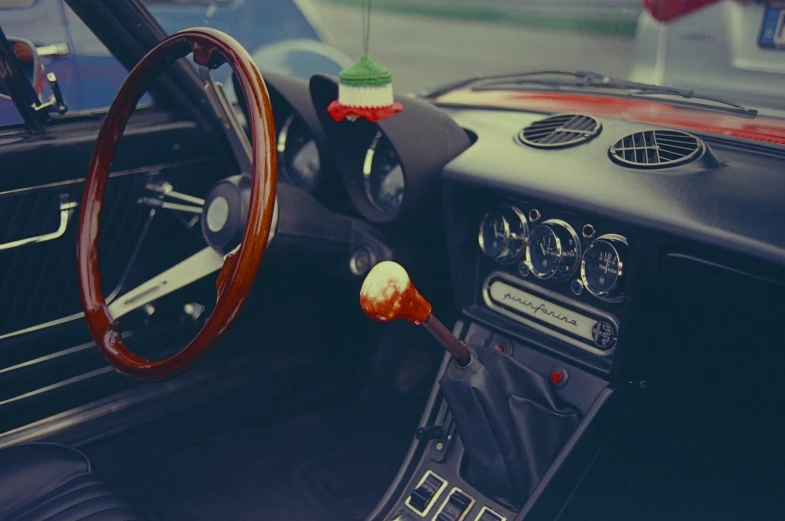 there is a car dashboard, steering wheel and controls in it