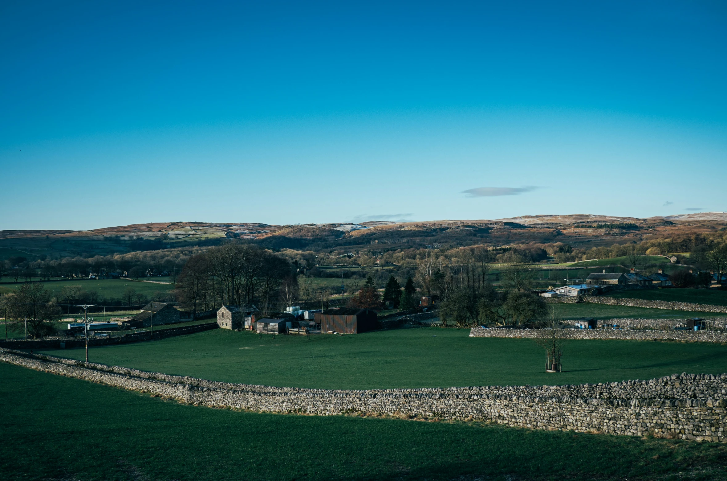 a large field that has many buildings in it