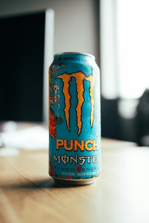 a can of beer sitting on a wooden table