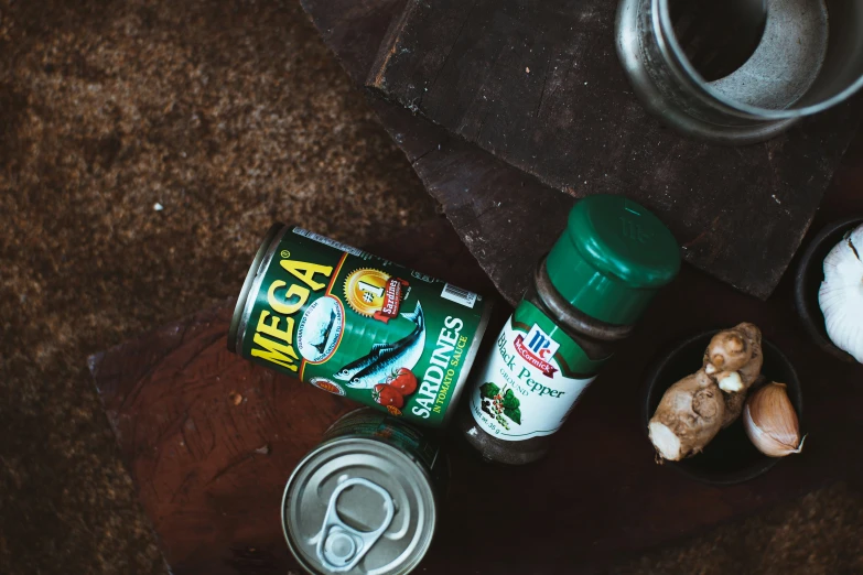 an aerial view of some cans, garlic and gingerbread paste