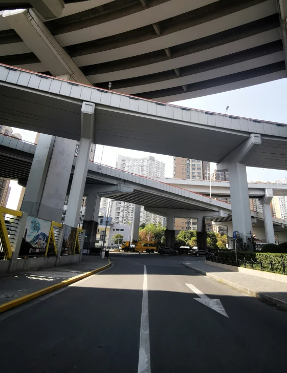 an overhead overpass and street with many buildings